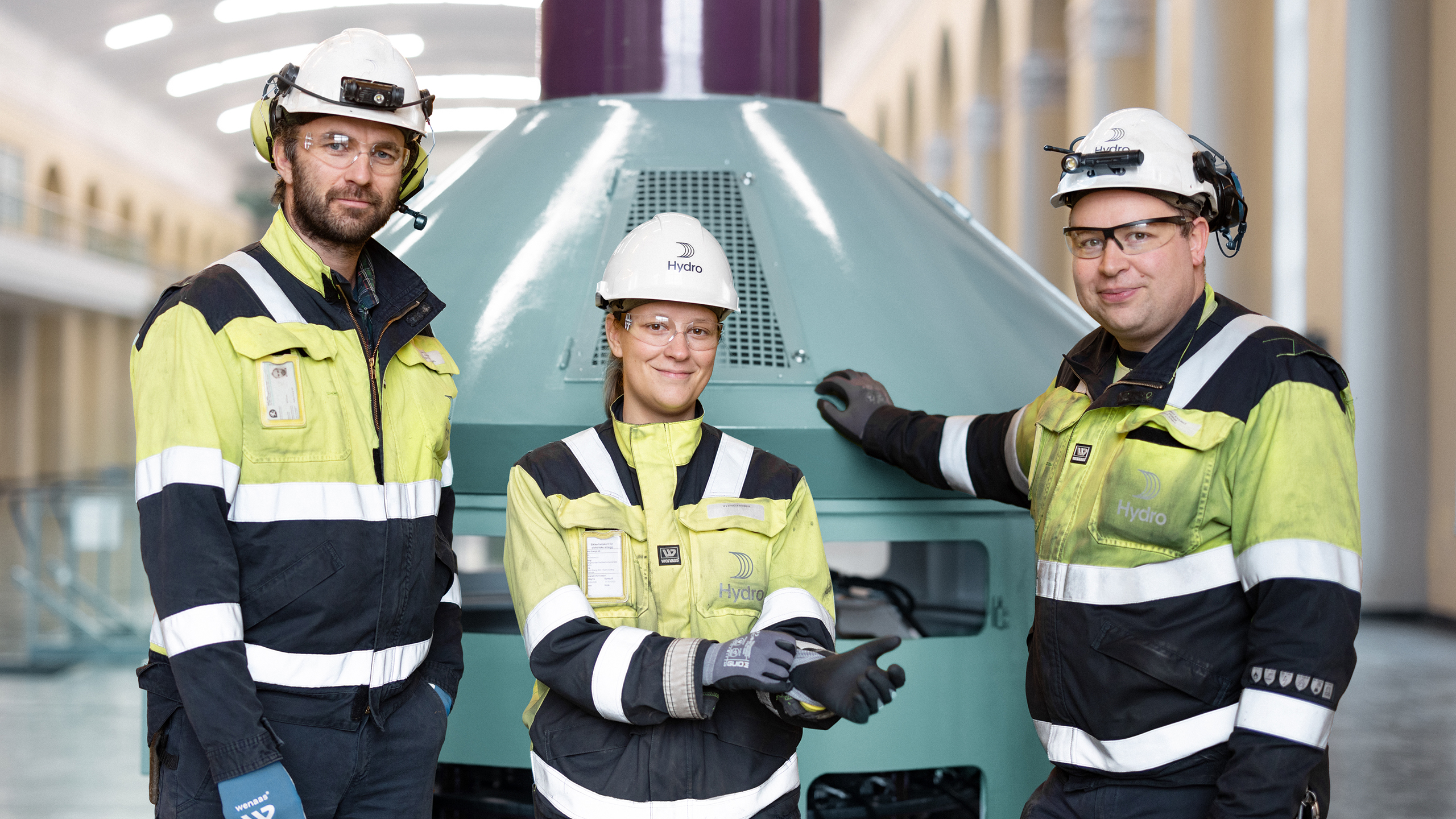 a group of people wearing safety vests and standing next to each other