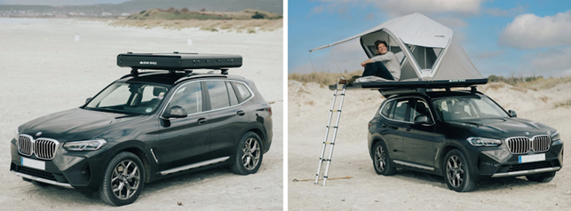 a person standing next to a car with a tent on top