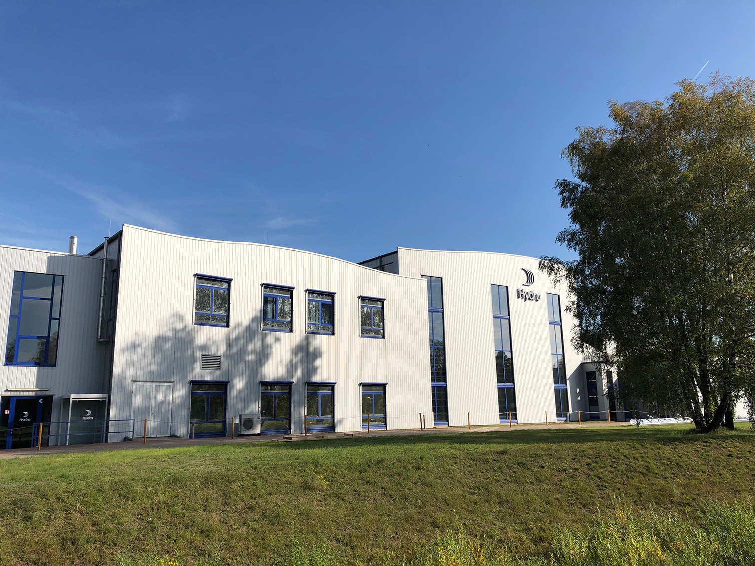 a building with a tree in the background
