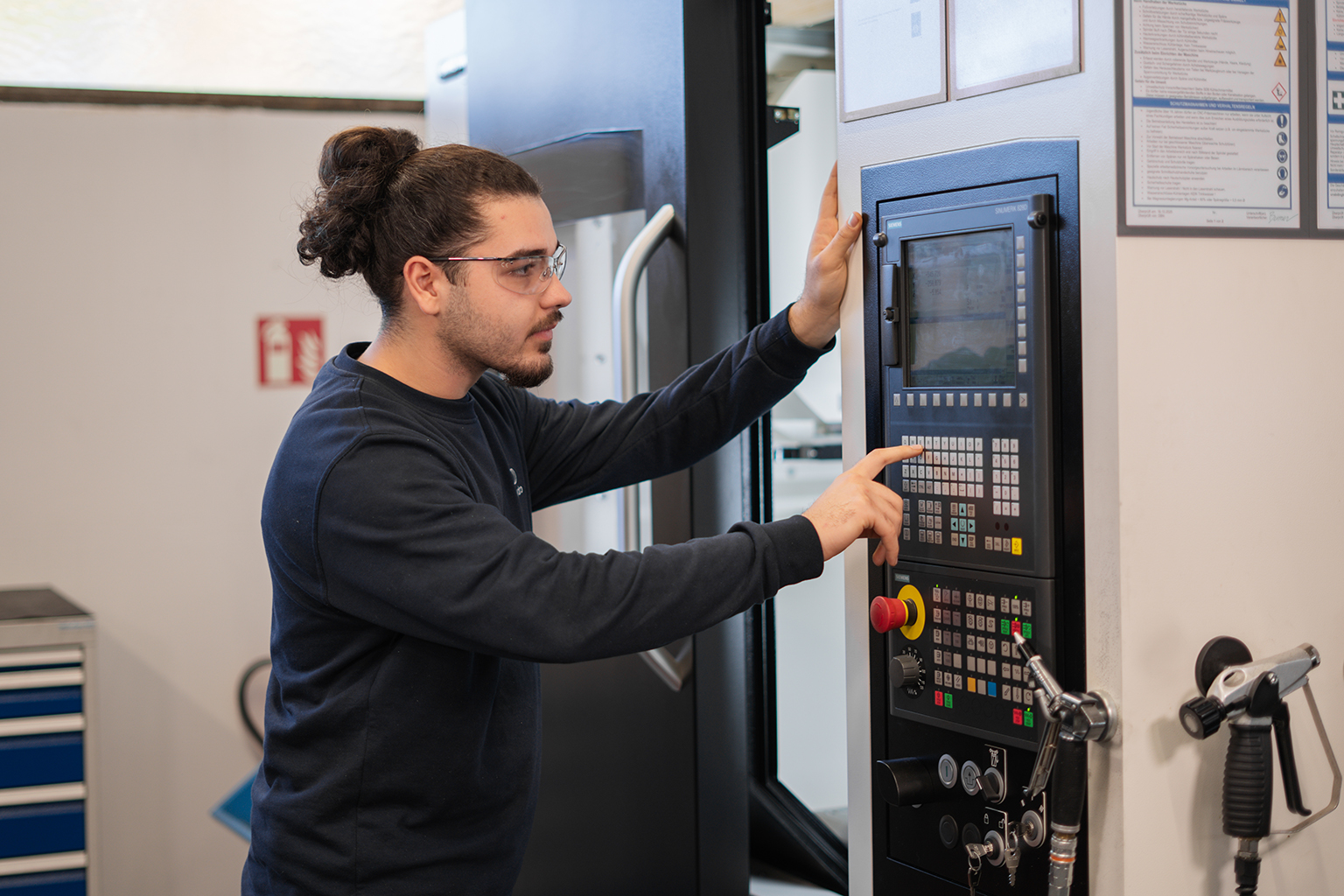 a man touching a machine