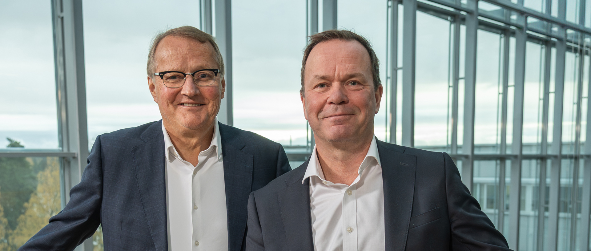 two men standing next to each other