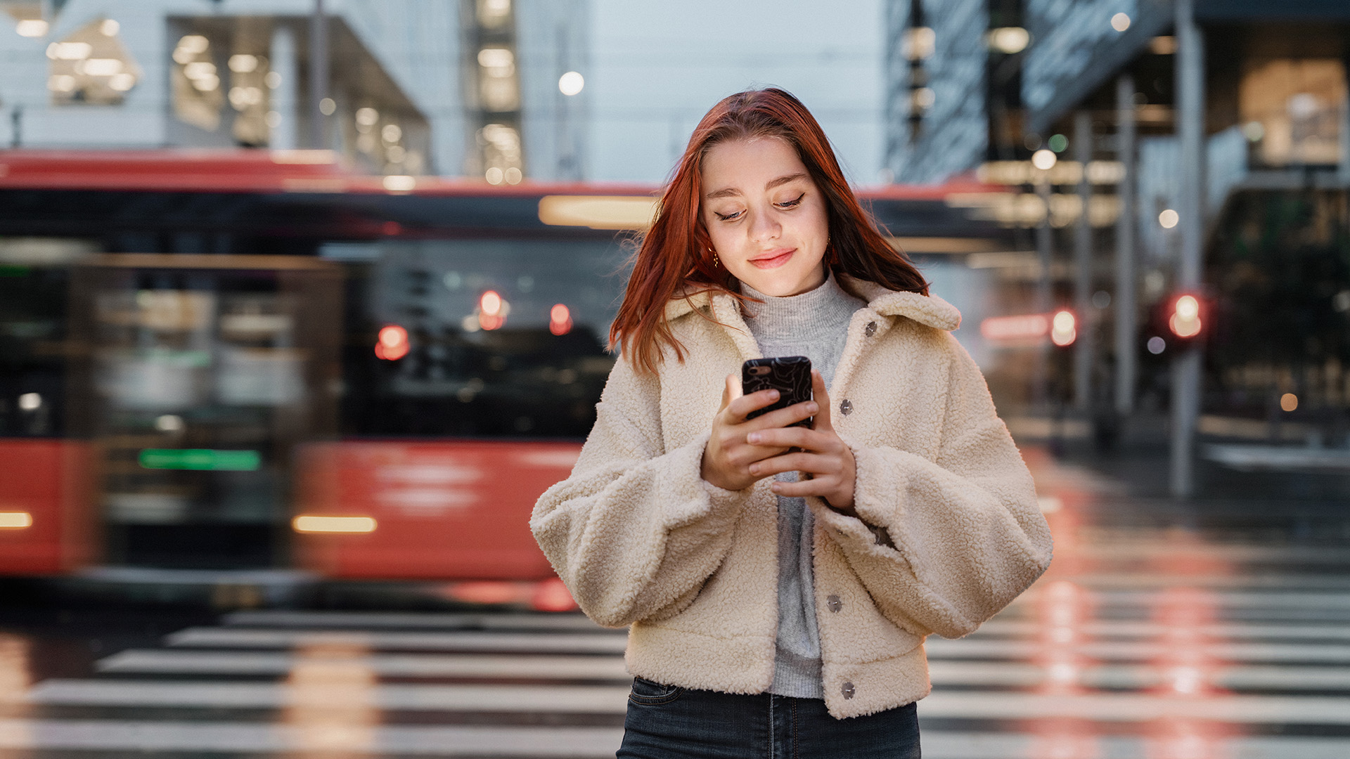 a woman looking at a phone