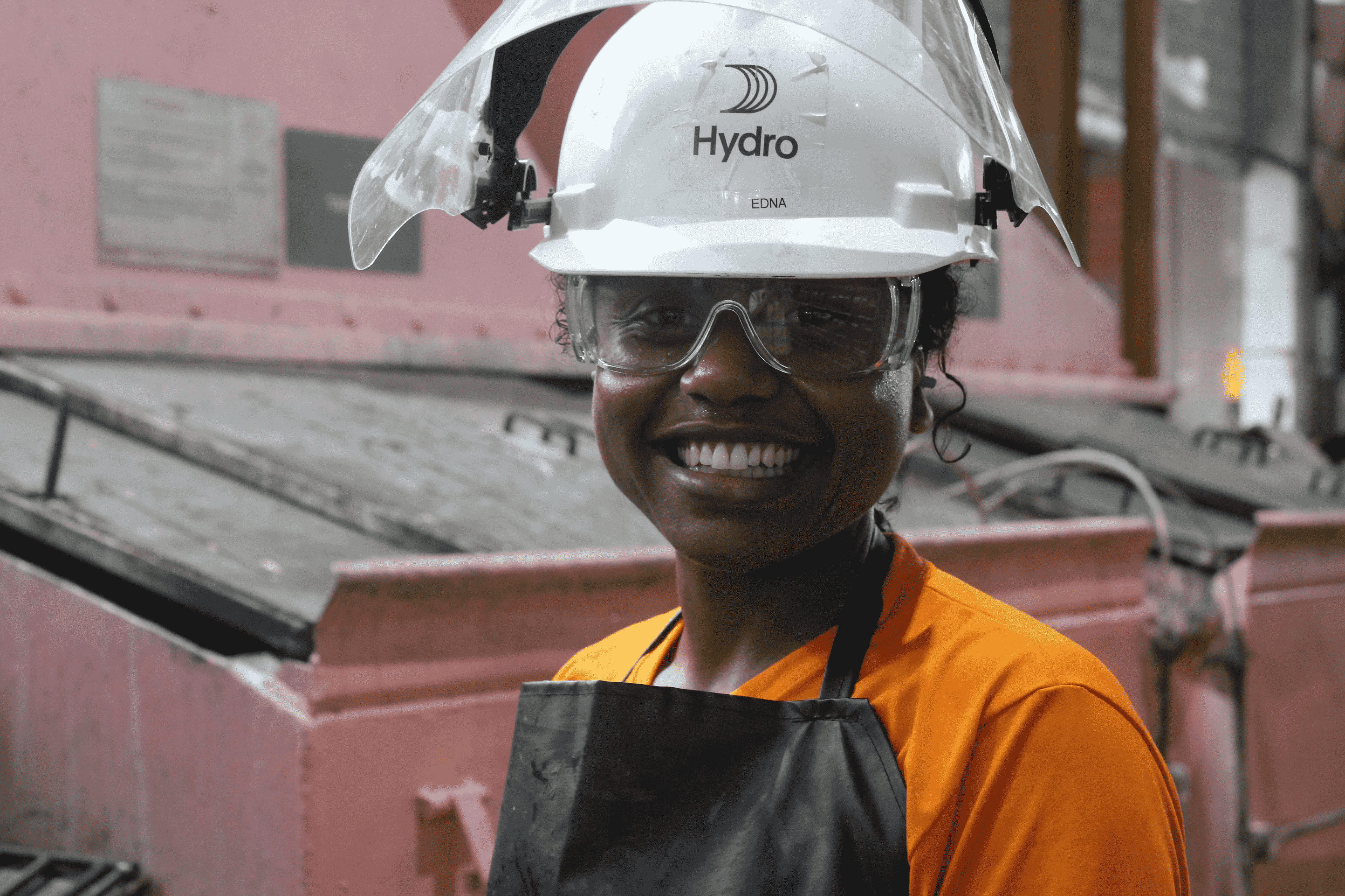 a man wearing a hard hat and safety goggles