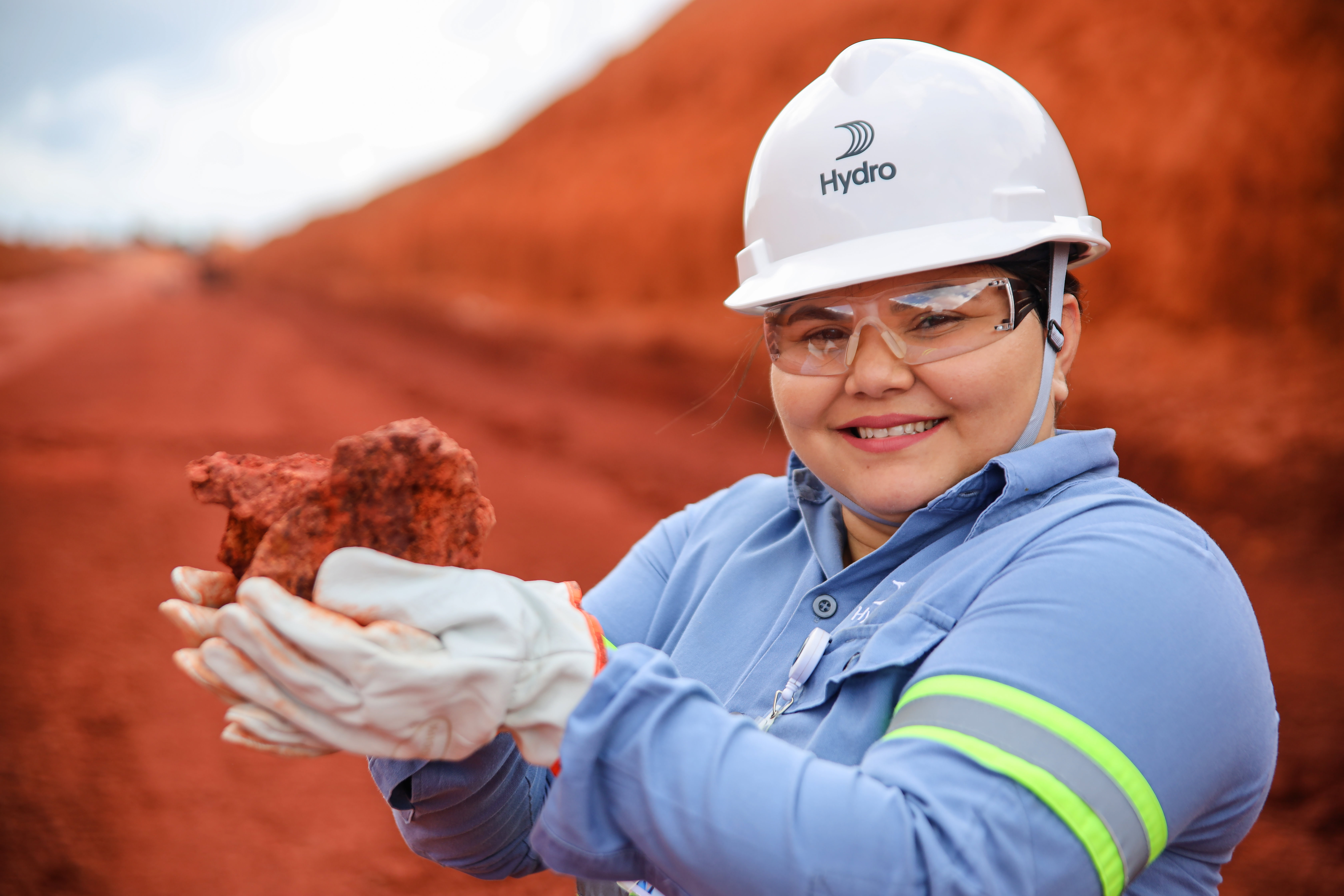a person holding a chicken