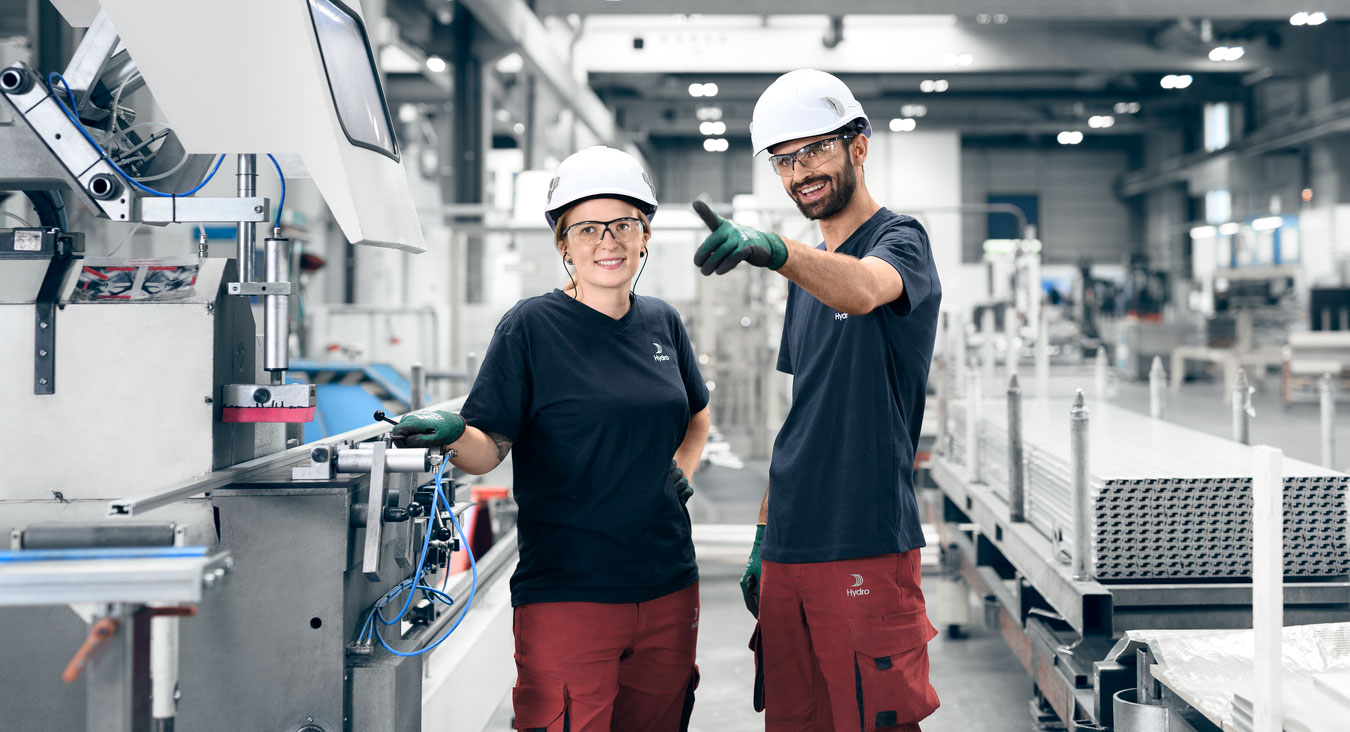 a man and a woman wearing hard hats and gloves
