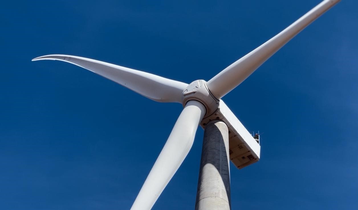 a windmill with a blue sky