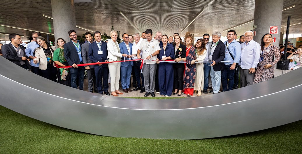 a group of people standing on a black platform