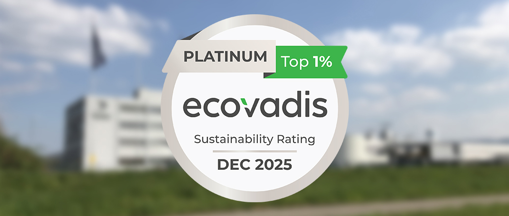 a white circle with black text and green ribbon