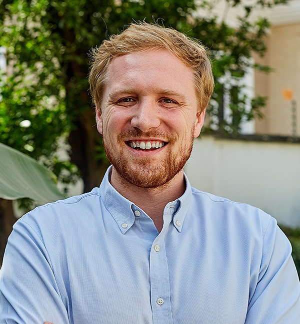 a man smiling for a picture