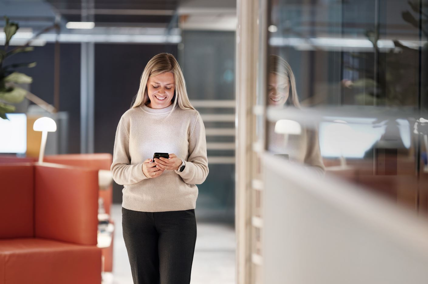a woman holding a phone