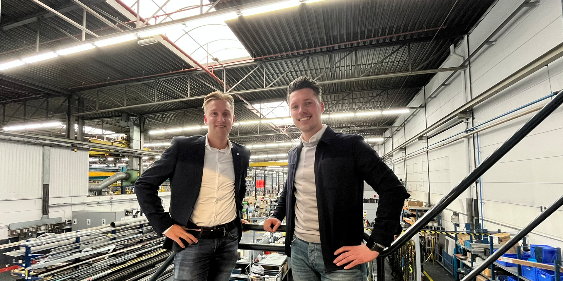 a couple of men posing for the camera